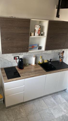 a kitchen with a sink and a counter top at Marble apartment in Prato