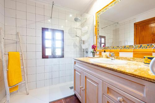a bathroom with a sink and a mirror at Can Xisco Pollensa in Port de Pollensa