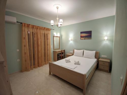 Ένα ή περισσότερα κρεβάτια σε δωμάτιο στο Thomas Apartments