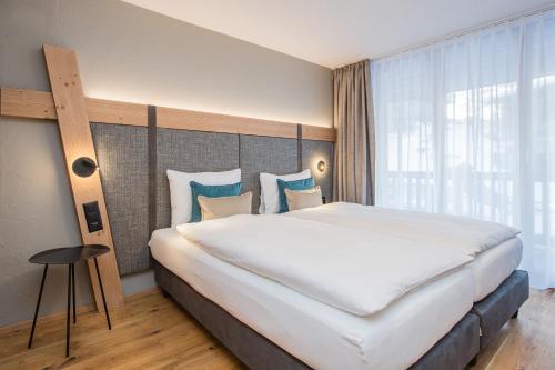 Postel nebo postele na pokoji v ubytování Arctis - Wohnung Lea