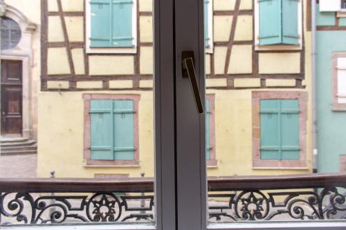 a window with a bench in front of a building at MY SWEET HOMES - Appartements avec SPA in Colmar