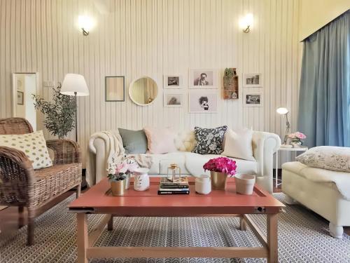 a living room with a couch and a coffee table at Greenhill Resort Cameron Highland in Tanah Rata
