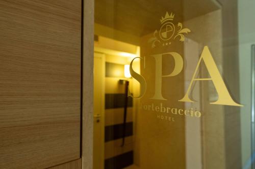 a sign for a spa in a hotel room at Fortebraccio in Montone