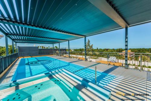 a large swimming pool on the top of a building at Baltic Apartments - Seaside Garden Apartments & Wellness in Świnoujście