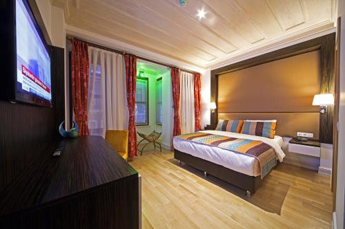 Postel nebo postele na pokoji v ubytování Ottopera Hotel