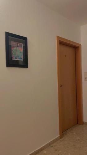 a room with a door and a picture on the wall at Hotel Zemlinski in Payerbach