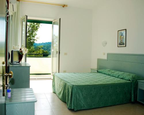 Postel nebo postele na pokoji v ubytování Paglianza Hotel