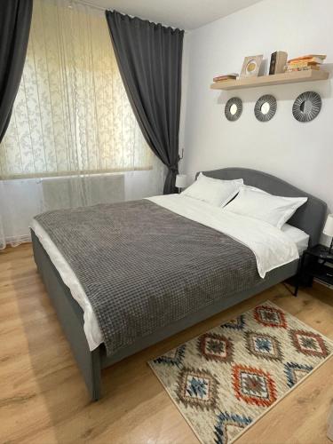 Postel nebo postele na pokoji v ubytování Apartament Cina