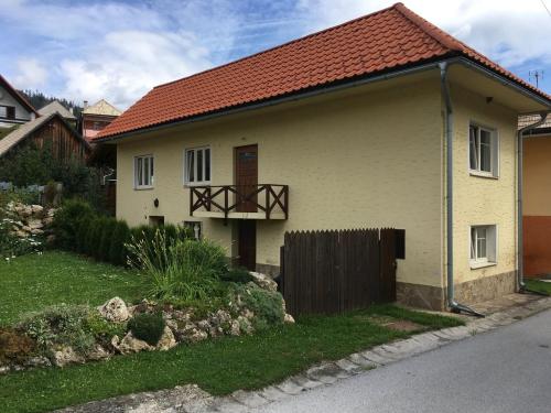 a white house with a red roof at Chalupa Barbolica in Vernár