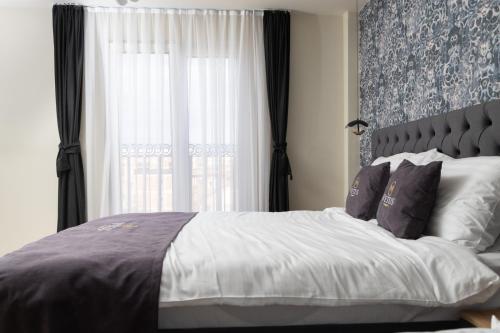 Postel nebo postele na pokoji v ubytování Vetus Hotel