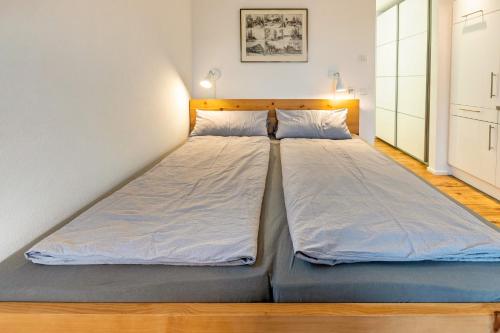 a large bed in a room with at Ferienwohnung Sonnenhalde in Moos