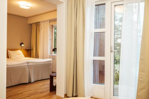 Ένα ή περισσότερα κρεβάτια σε δωμάτιο στο Barken Lodge