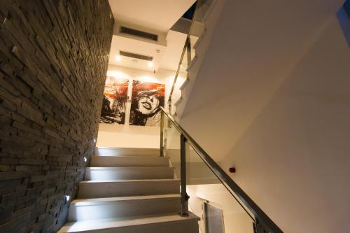 a staircase in a house with a brick wall at Perla Luxury in Ulcinj