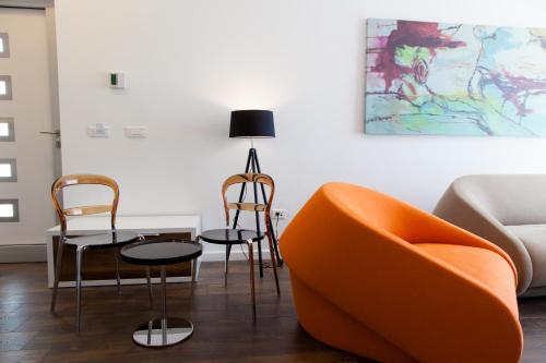 a living room with two chairs and a table at Perla Luxury in Ulcinj