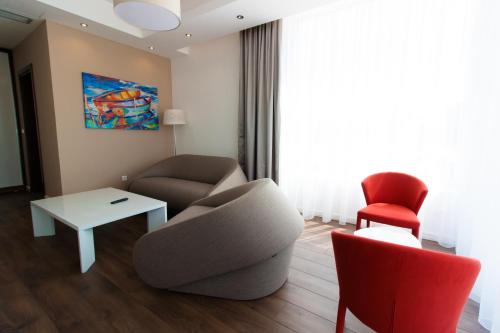 a living room with a couch and a chair at Perla Luxury in Ulcinj