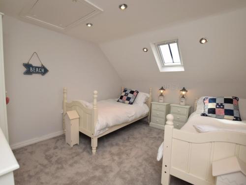 a small bedroom with a bed and a window at 3 bed in Bamburgh 87918 in Bamburgh