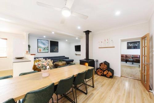 a living room with a large table and chairs at The Orange Door Mudgee -a spacious home in town in Mudgee