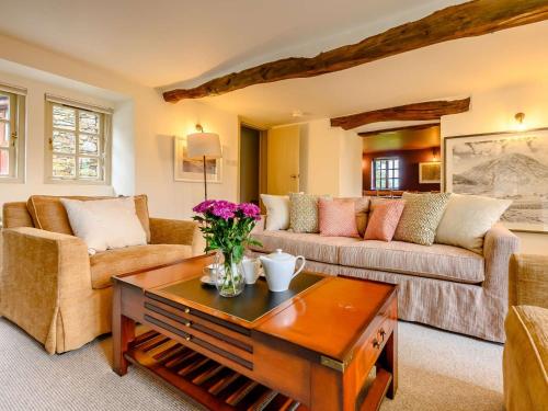 a living room with two couches and a coffee table at 3 Bed in Buttermere 88773 in Buttermere
