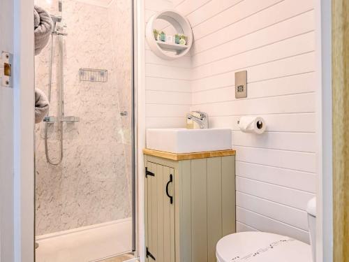 a bathroom with a sink and a shower at 1 Bed in Ennerdale Bridge 88672 in Frizington