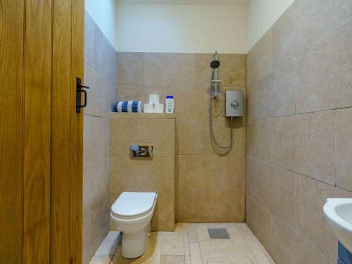 a bathroom with a toilet and a shower at 4 Bed in Durham 89858 in Willington