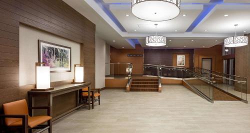 a lobby of a hospital with a staircase and a stair case at Hyatt House New Orleans Downtown in New Orleans