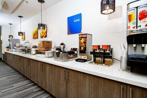 a kitchen with a counter with many appliances on it at Comfort Suites Oil Center in Lafayette