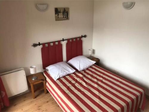 En eller flere senge i et værelse på Appartement Valloire 6-8 pers