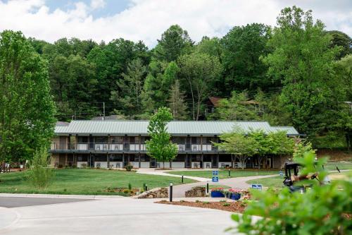an exterior view of a building with trees at Waynesville Inn and Golf Club, Tapestry Collection by Hilton in Waynesville