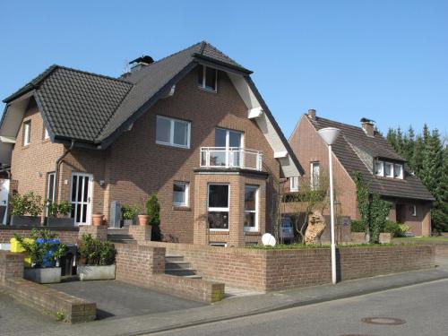 a brown brick house with a black roof at Nettetal - free2beme in Nettetal