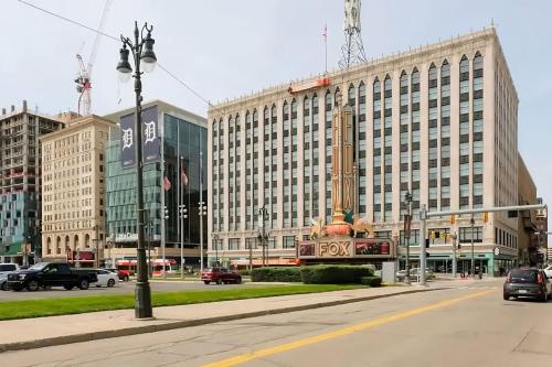 a large building with a sign in front of it at Amazing 1 BR Apt In City Center in Detroit