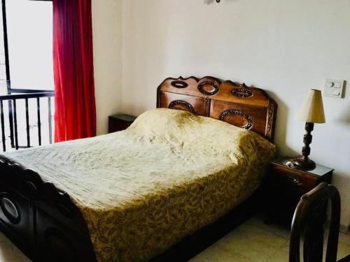 Postel nebo postele na pokoji v ubytování FlyHigh Holiday Homes near Baga Beach