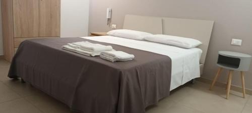 Säng eller sängar i ett rum på Attico Viola