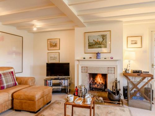 a living room with a couch and a fireplace at 4 Bed in AYR 90038 in Ayr