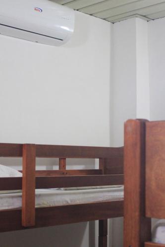 a room with a wooden bench and a ceiling at BnT Inn in Mactan