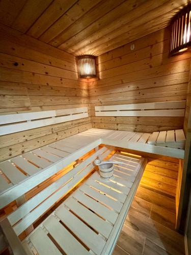 a inside of a sauna with a bucket in it at Ferienwohnung Gompitzer in Heiligenblut