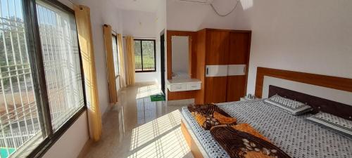 Postel nebo postele na pokoji v ubytování Anushree home stay, Amarkantak