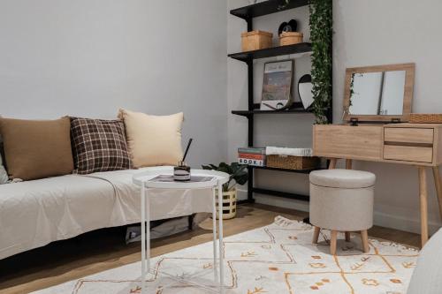 a living room with a bed and a table at Near Hongdae CozyBrickhaus in Seoul