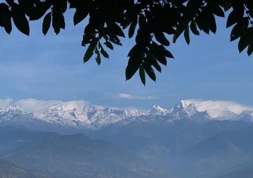 a view of snow covered mountains in the distance at The Lapsi Tree in Nagarkot