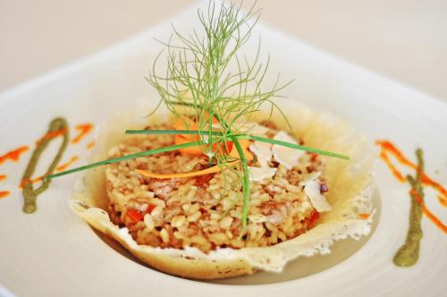 a dish of food on a white plate at Grand Hotel Palladium Santa Eulalia del Río in Santa Eularia des Riu