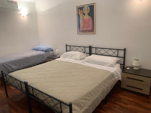 Ένα ή περισσότερα κρεβάτια σε δωμάτιο στο a casa di lu