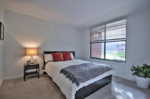 a bedroom with a large bed and a window at South Beach 1br w heated pool nr att park SFO-1657 in San Francisco