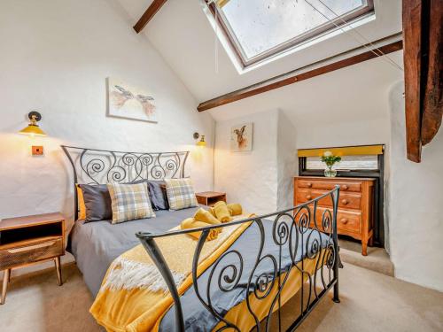 a bedroom with a bed and a skylight at 2 Bed in Lanhydrock 90216 in Bodmin