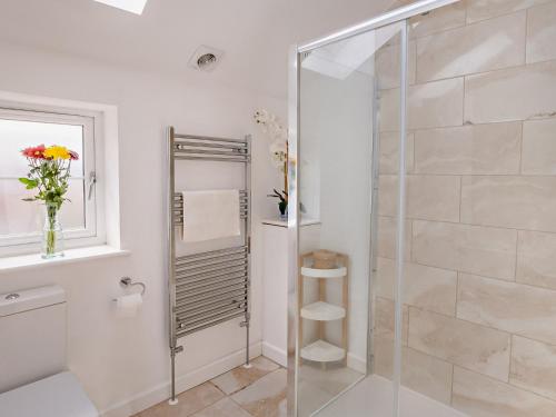 a bathroom with a shower with a glass door at 4 Bed in Newport 90249 in Newport