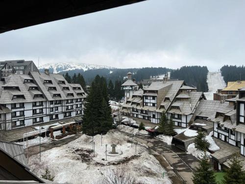 arial view of a resort town with snow covered buildings at Vučko apartmani Konaci in Kopaonik