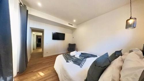 a living room with a bed and a couch at MyHome Urban Apartments-Air Conditioning-City Center in Puerto del Rosario
