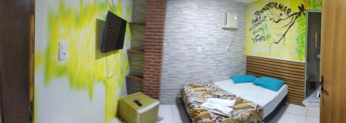 Giường trong phòng chung tại Pousada João de Barro
