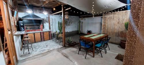 a patio with a table and chairs in a garage at casa villa costa de sol, calderilla in Calderilla