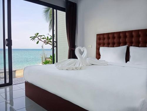 Postel nebo postele na pokoji v ubytování March Samui Resort