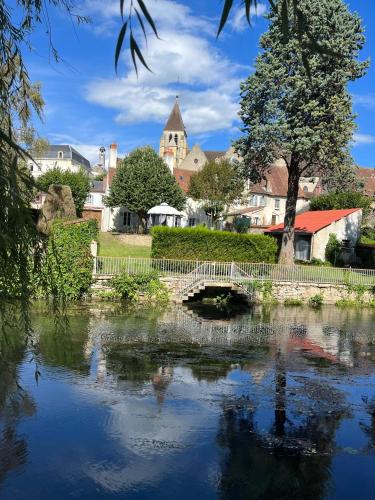 a bridge over a river in a small town at Studio tropical , vierzon , proche gare , tout confort in Vierzon