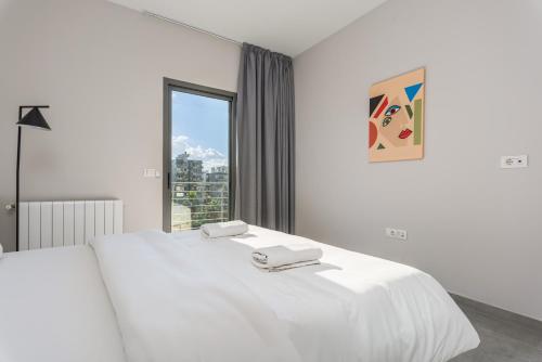 Postel nebo postele na pokoji v ubytování Le 115 Aparthotel in Jal El Dib